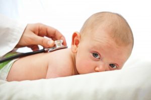 baby portrait and pediatrician check